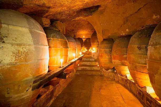 Antique winery in Spain with clay vessels terracotta amphora  pots Mediterranean tradition with candlelight