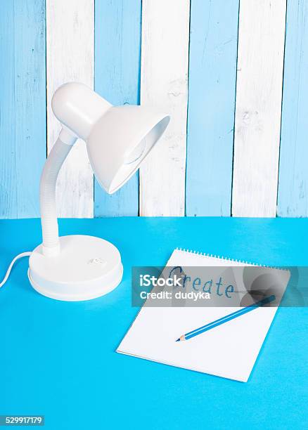 White Lamp On Blue And White Background With Note Stock Photo - Download Image Now - Abstract, Blue, Colors