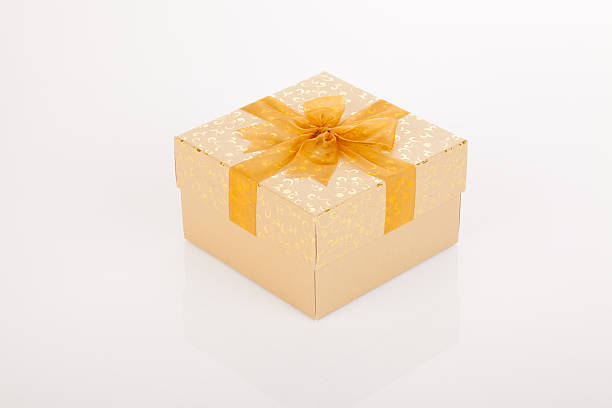istock Golden gift box with golden bow on lid 529918115
