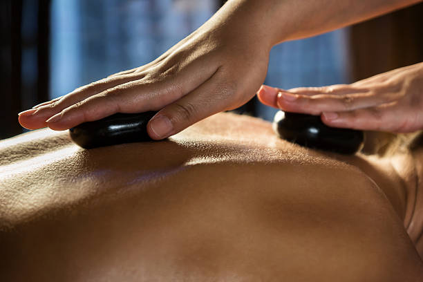 Stone massage closeup stock photo