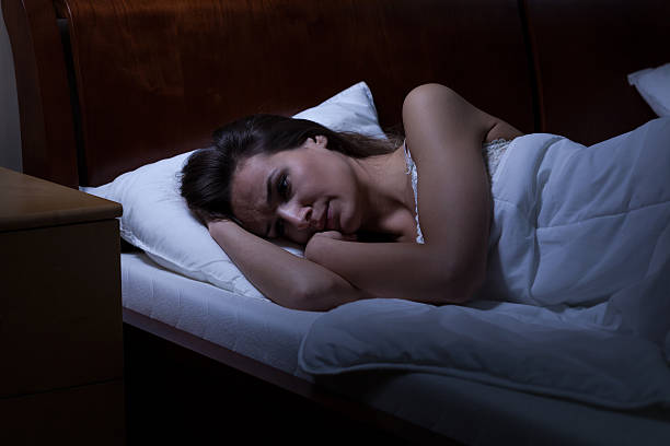 istock Woman lying in bed 529921353