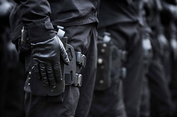 istock Soldier hand on a pistol 529930705