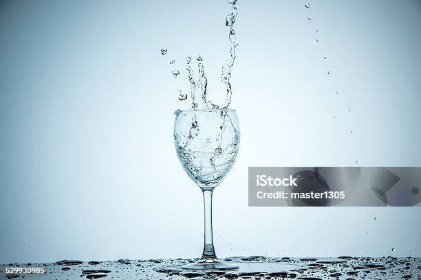 Glass Being Filled With Water Stock Photo - Download Image Now - Glass - Material, Splashing, Spray