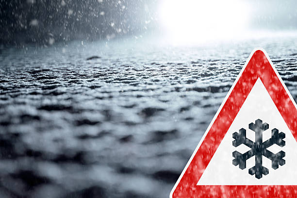 istock Winter Driving - Winter Road - Caution Snow 529948313