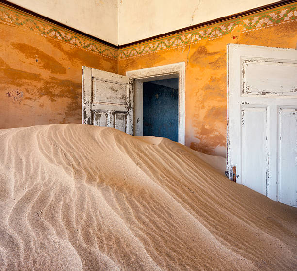 Abandoned House, Kolmanskop Sand overtaking the ghost town of Kolmanskop, Namibia. kolmanskop namibia stock pictures, royalty-free photos & images