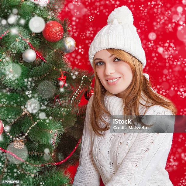 Beautiful Young Woman Near Christmas Tree Stock Photo - Download Image Now - Adult, Adults Only, Beautiful People