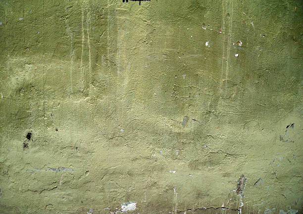 istock Texture of old wall covered with green stucco 529952707