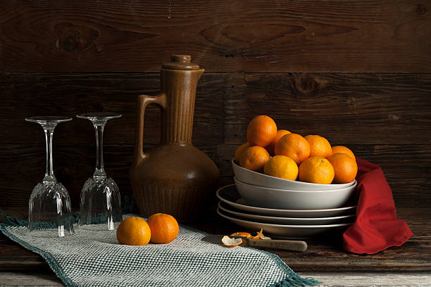 Still life of oranges and glasses.