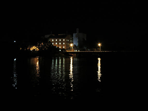 Northam Mill at Night The flour mill and its reflection in the river at night in Northam, Western Australia flour mill stock pictures, royalty-free photos & images