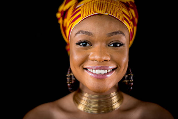 Full length of 20-29 years old african ethnicity / african-american ethnicity young women / female in front of white background wearing headscarf / dress / traditional clothing who is shouting / screaming / displeased / angry