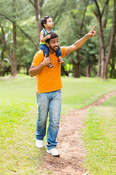 istock caring young indian father and son 529969071