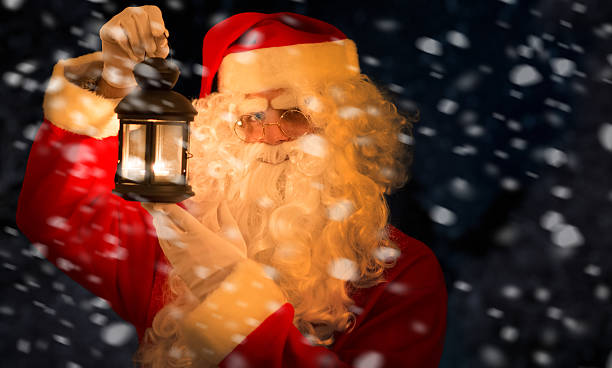 istock Santa Claus holding a lantern 529969105