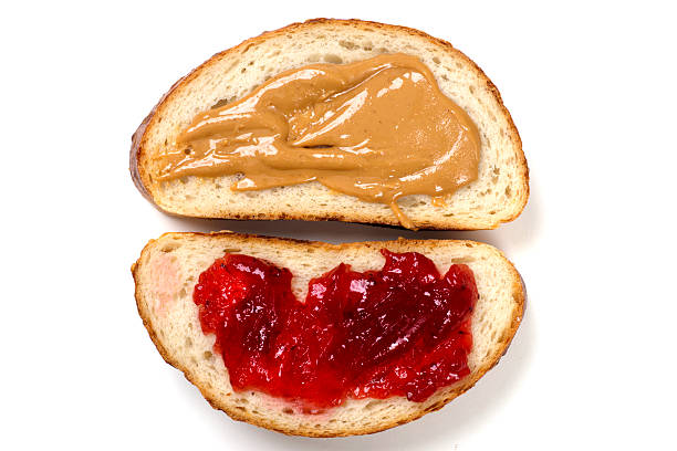 istock Open Face Sandwich with Peanut Butter and jelly Isolated 529977863