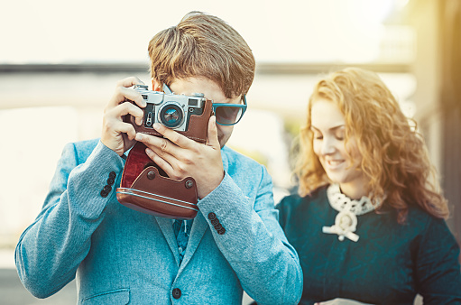 Hipster man wants to take a picture using your vintage camera
