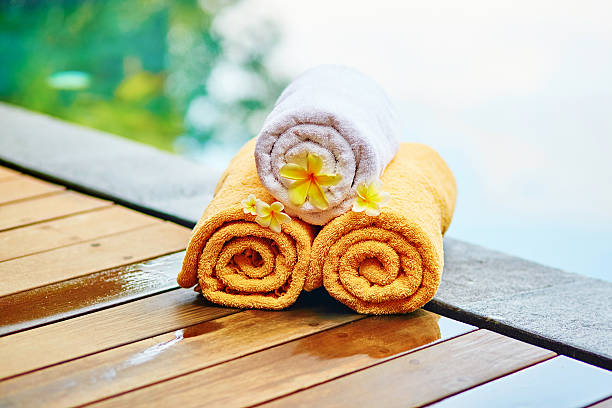 istock Towels with frangipani flowers in Balinese spa 529979721