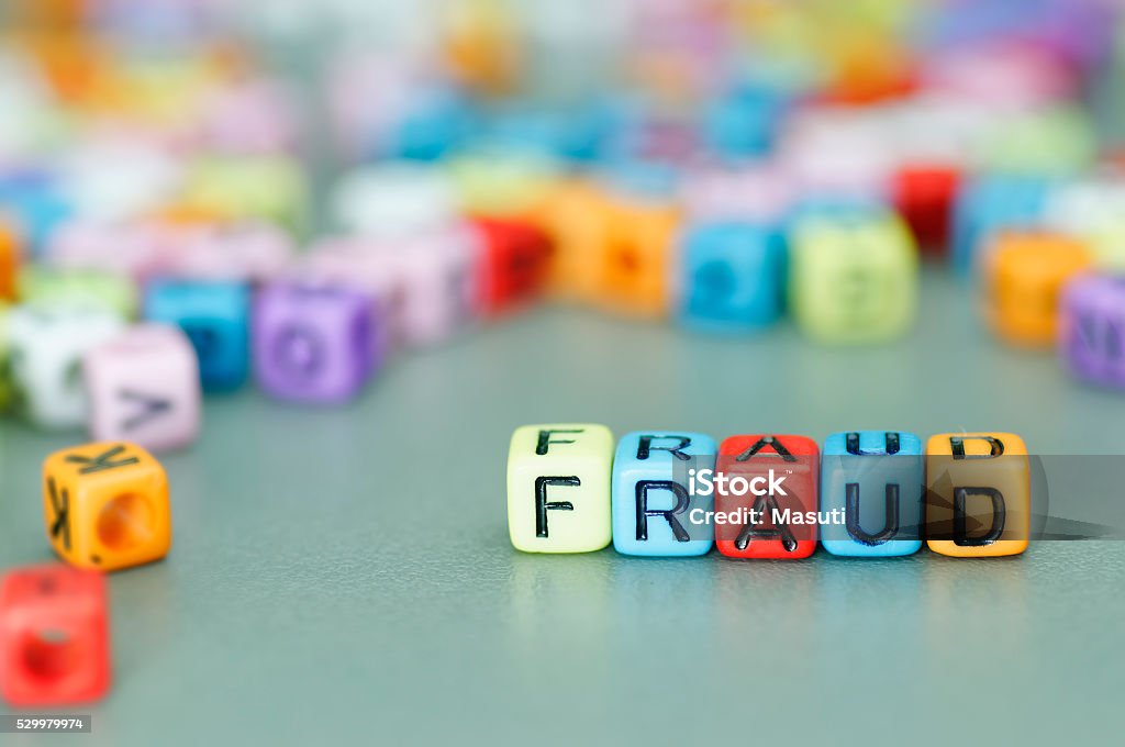 Fraud word on dices Fraud word on colorful dices Protection Stock Photo