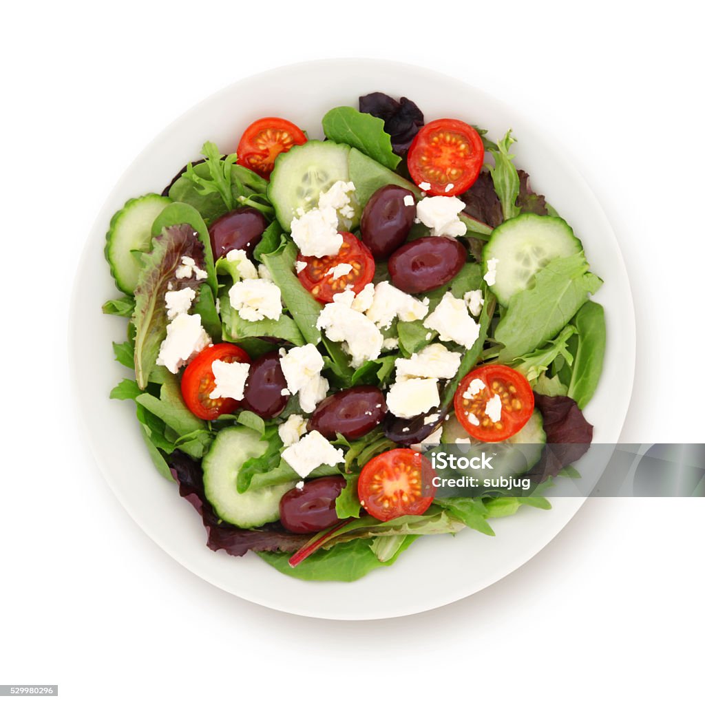 Greek Salad Greek salad with cucumber, cherry tomatos, olives and feta cheese isolated on white (excluding the shadow) Salad Stock Photo