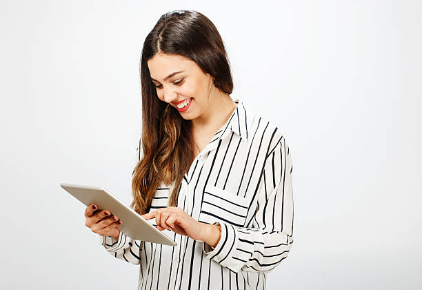 istock Young woman with digital tablet 529980470