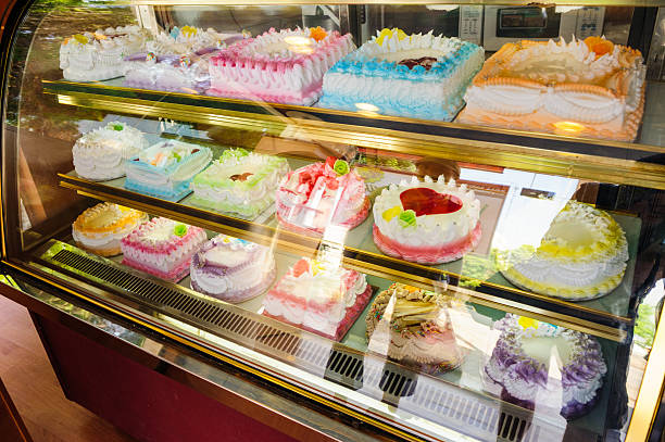istock Variety of cakes in window in Oman 529980596