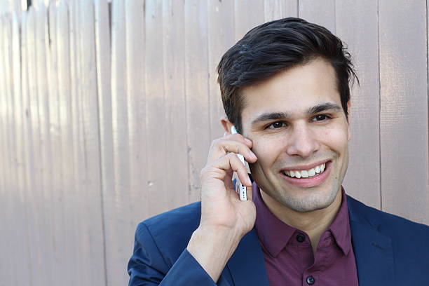 istock Young man enjoying talking on phone 529983458