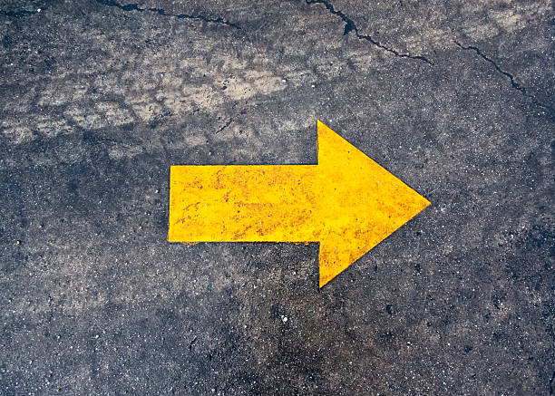 istock arrow on the asphalt road 529983763