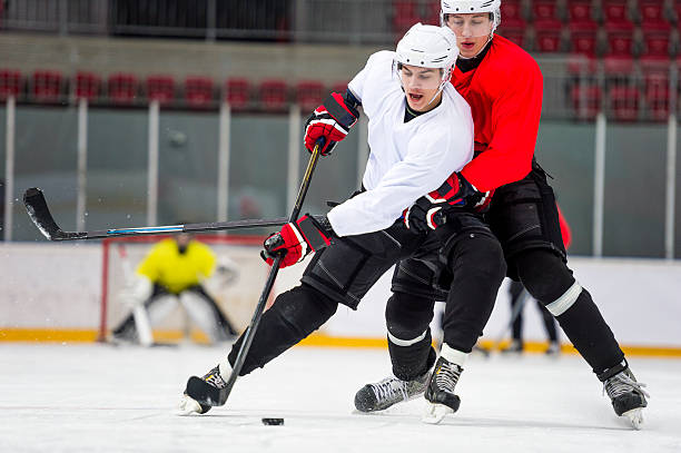 istock Two Ice Hockey Players Dueling 529983945