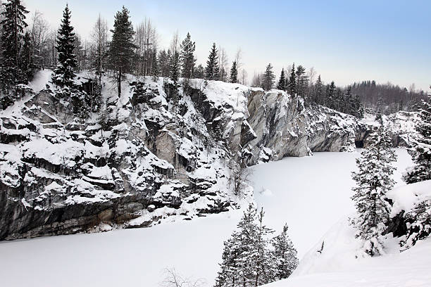 istock Winter snowfall in old marble quarry, Karelia, Russia 529984021