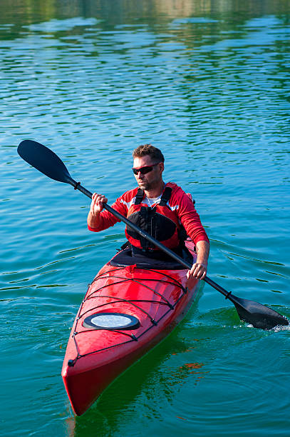 istock man kayaking on the lake sunset02 529984094