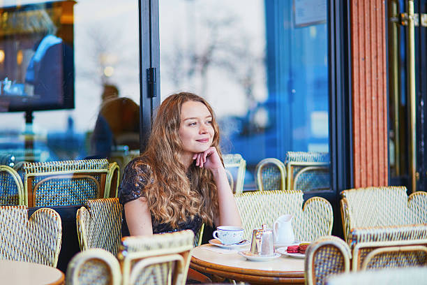 istock Beautiful Parisian woman in cafe 529984846