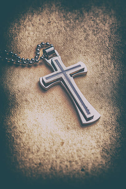 istock Closeup of silver Christian cross 529985210