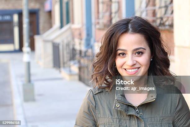 Smilie Young Woman In Green Jacket Stock Photo - Download Image Now - Women, Egyptian Culture, Teenager