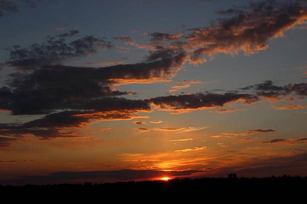 istock beautiful sunset in the field 529986636