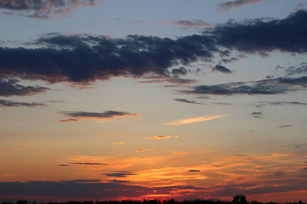 istock beautiful sunset in the field 529987216