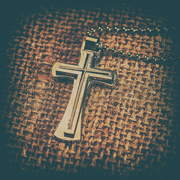 istock Closeup of silver Christian cross 529987272