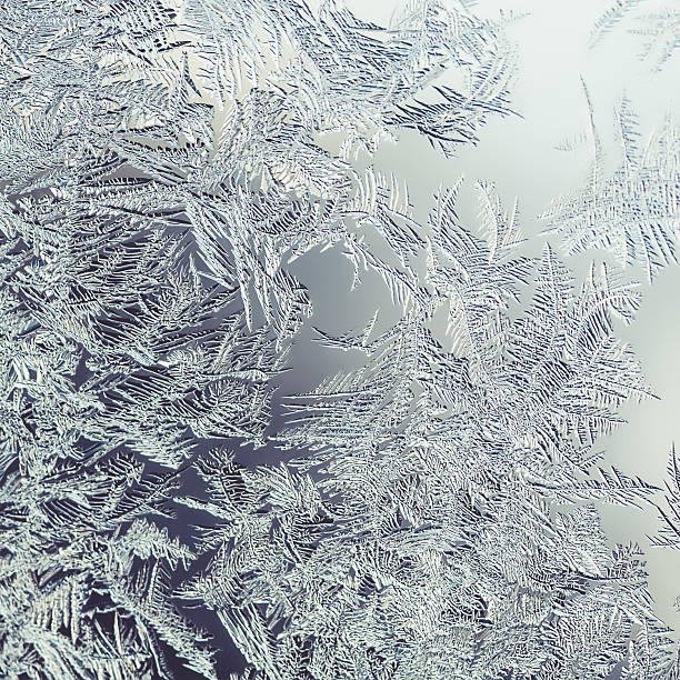 istock Beautiful Winter Window Pane Coated By Icy Frost Shiny Patterns 529987690