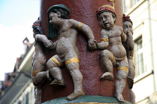 Dancing young blacks - a sculpture on the pillar in Bern