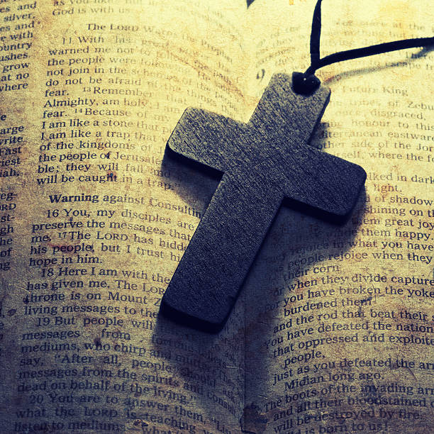istock wooden cross on a old bible 529989246