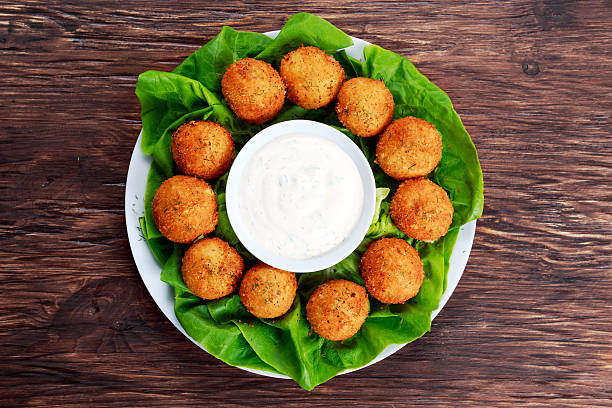 istock Fried mozzarella cheese stick balls with white sauce 529991176