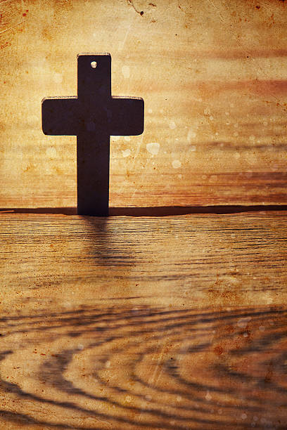 istock Old cross on a brown wood 529991566