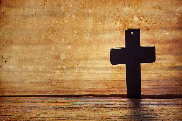istock Old cross on a brown wood 529991672