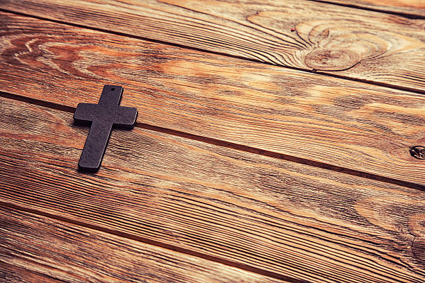 istock Old cross on a brown wood 529991790