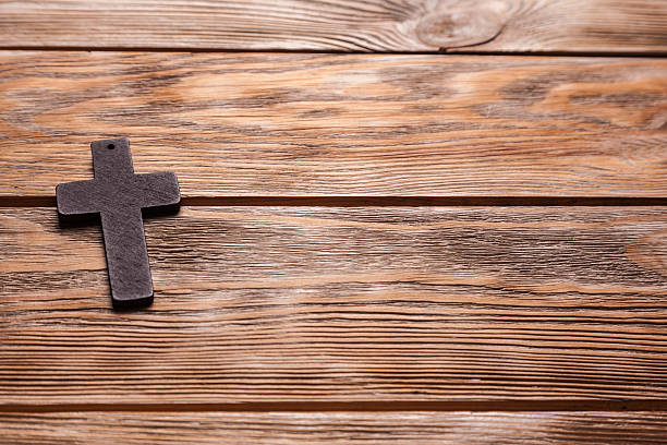 istock Old cross on a brown wood 529991856