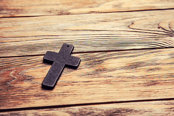 istock Old cross on a brown wood 529991988