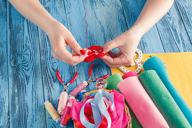 istock women sews by hand and making handmade heart 529992738