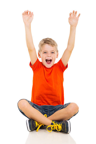 istock happy little boy arms up 529992919
