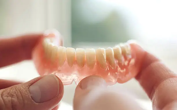 Dental technician  working in dental laboratory