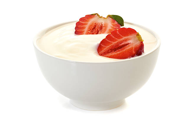 istock Yogurt with strawberries in bowl on white 529995286
