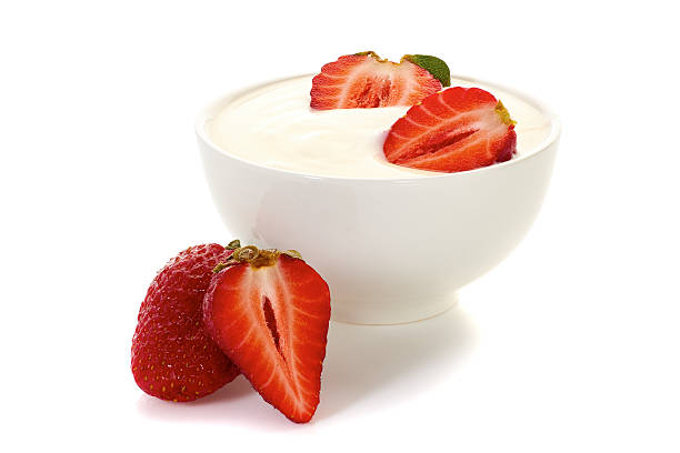 istock Yogurt with strawberries in bowl on white 529995406