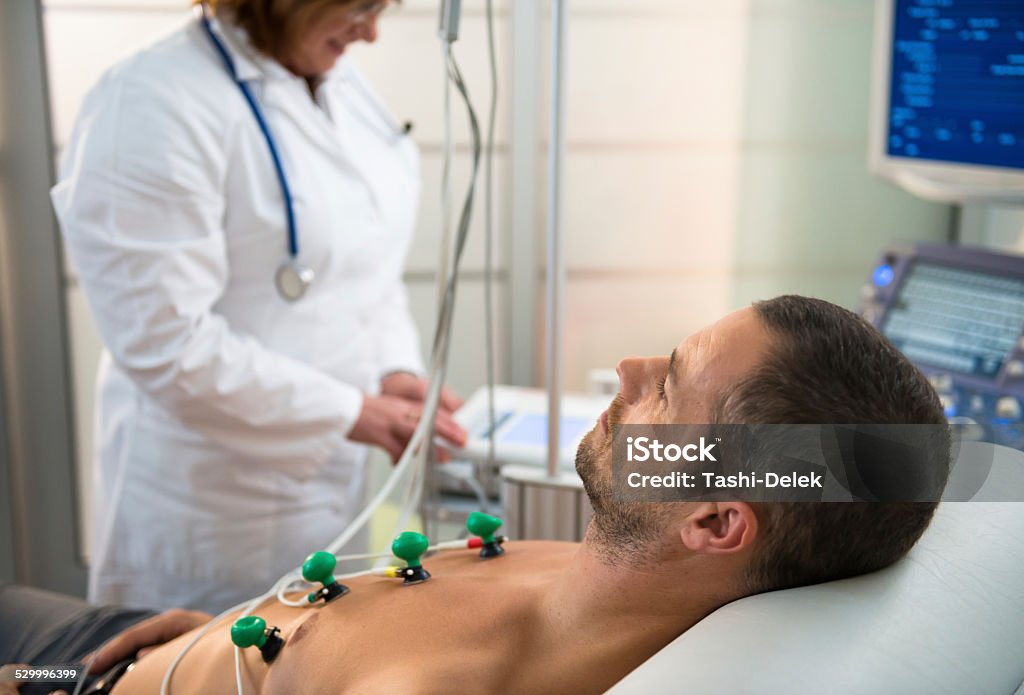 EKG Test Female doctor makes the patient ready for EKG test. Electrocardiography Stock Photo