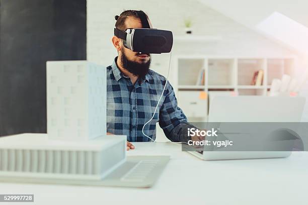 Architect Using Virtual Reality Glasses In His Office Stock Photo - Download Image Now